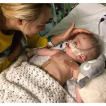 Baby Michael wakes from a five-day coma and smiles at his father while battling a rare cardiac fibroma heart tumor.