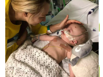 Baby Michael wakes from a five-day coma and smiles at his father while battling a rare cardiac fibroma heart tumor.